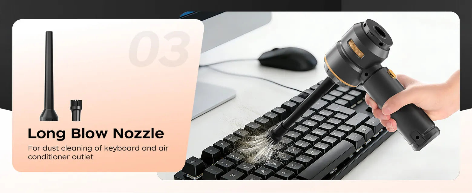 Black VNOST cordless car vacuum using a long blower nozzle to remove dust from a computer keyboard