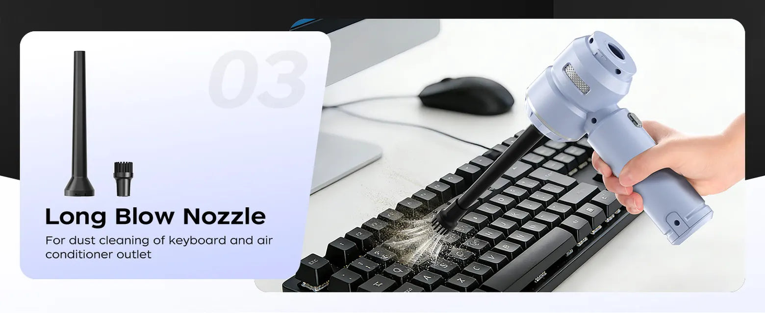 Blue VNOST cordless car vacuum using a long blower nozzle to remove dust from a computer keyboard
