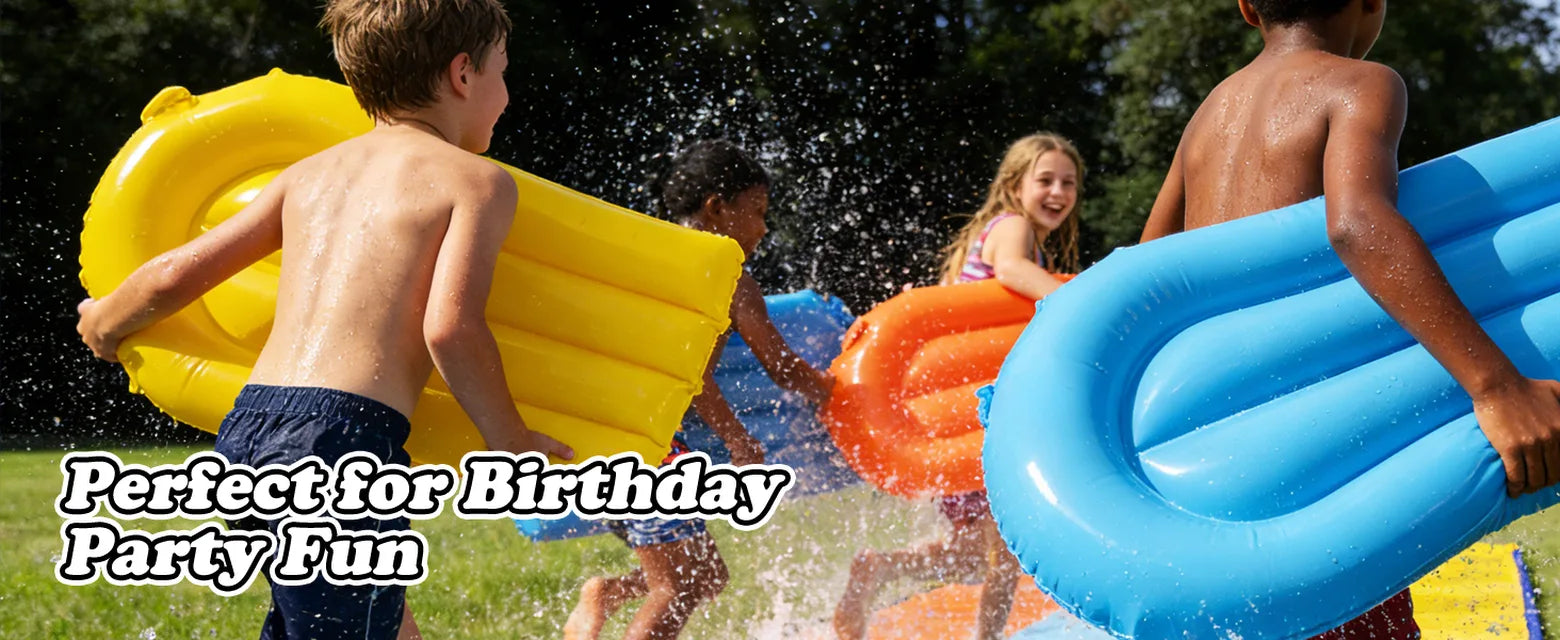 Children carrying yellow, orange, and blue bodyboards beside a backyard slip and slide during an outdoor party